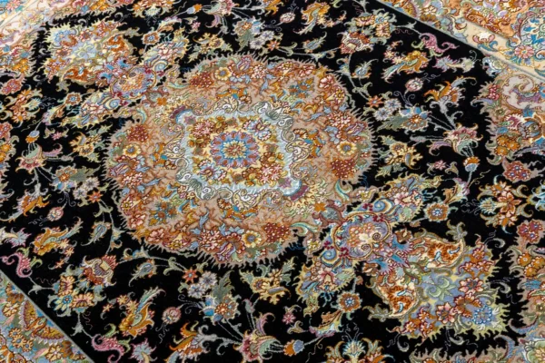 Persian Tabriz rug khatibi design with black medallion field and intricate floral border with silk and fine wool