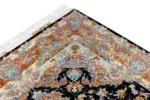 Persian Tabriz rug khatibi design with black medallion field and intricate floral border with silk and fine wool