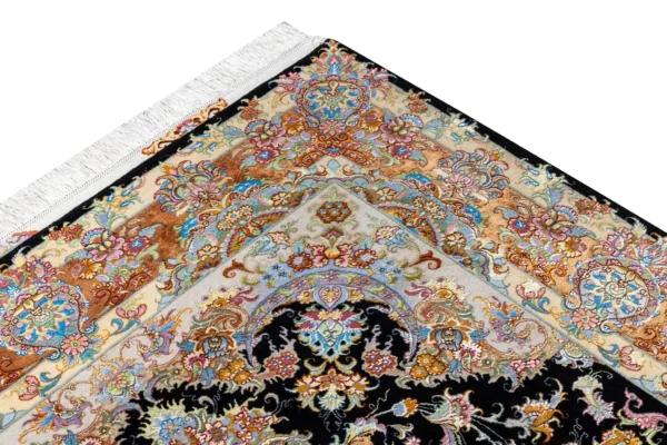 Persian Tabriz rug khatibi design with black medallion field and intricate floral border with silk and fine wool