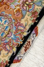 Persian Tabriz rug khatibi design with black medallion field and intricate floral border with silk and fine wool