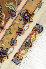 Hand-knotted Persian Khatibi rugs from Mashhad with intricate ivory and gold floral design, crafted in fine wool and silk.