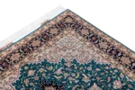 Hand-knotted Persian Heris design carpet from Tabriz, featuring teal green and black medallion pattern with silk-accented floral motifs – 2 x 1.5 meters.