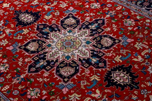 Persian Hand-knotted Tabriz Heris rug in red and navy in 3 sqm, fine wool on cotton with silk by Parsa Rugs.