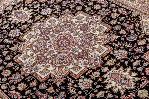 Hand-knotted Tabriz Heris rug in black and ivory with rose and pastel details, fine wool and silk accents, 3 sqm Parsa Rugs.