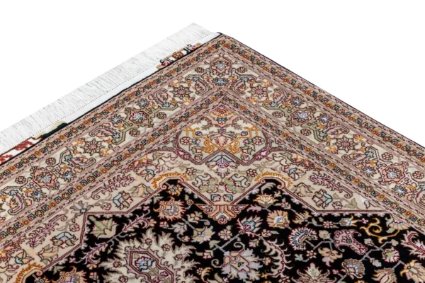 Hand-knotted Tabriz Heris rug in black and ivory with rose and pastel details, fine wool and silk accents, 3 sqm Parsa Rugs.
