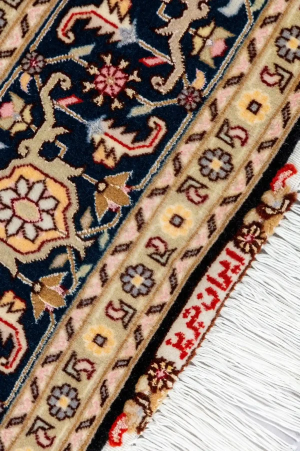 Hand-knotted Persian Tabriz Heris rug in black and cream tones with a central medallion, made of fine wool with silk highlights – 3 sqm, 50 Raj density.