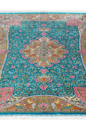 Qom silk carpet in full natural silk, hand-knotted in Iran with 80 Raj density. Features a turquoise floral design with central medallion.