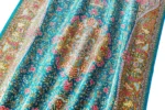 Qom silk carpet in full natural silk, hand-knotted in Iran with 80 Raj density. Features a turquoise floral design with central medallion.