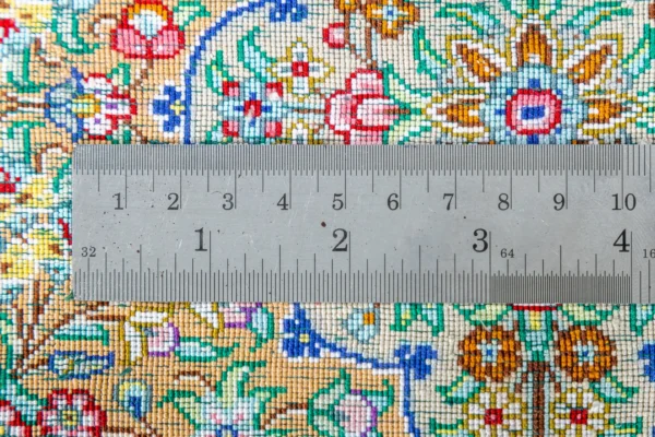 Qom silk carpet in full natural silk, hand-knotted in Iran with 80 Raj density. Features a turquoise floral design with central medallion.